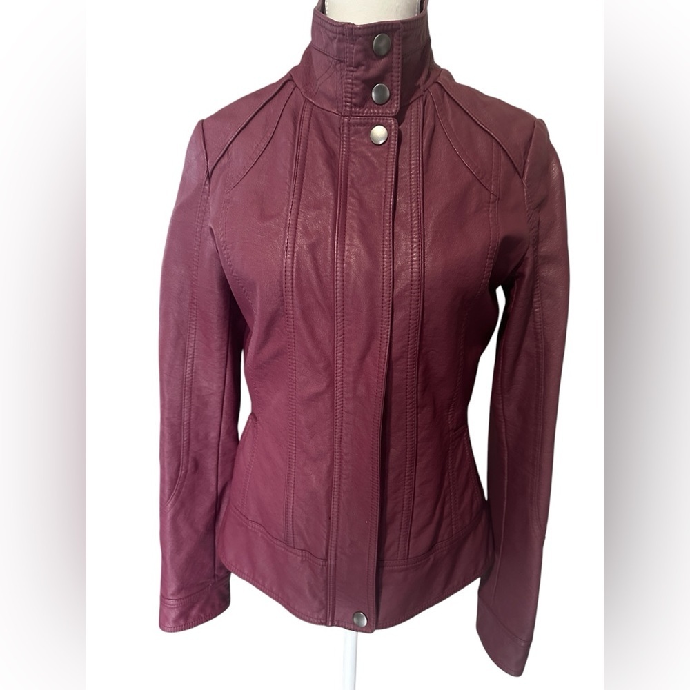 Ricki’s pleather jacket in a wine color, Size 4, gently used condition.